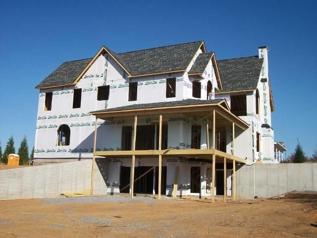 Home under construction with new residential roof from Adams Roofing Inc.